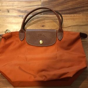Longchamp  small burnt orange bag .